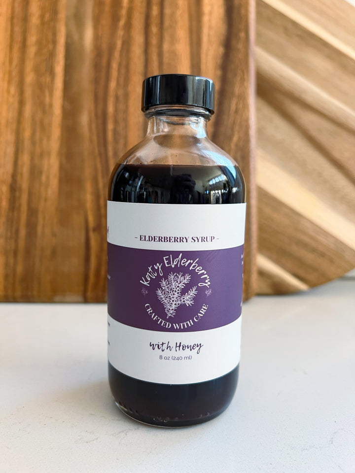 8 oz bottle of Katy Elderberry organic elderberry syrup with honey, a small-batch immune support supplement