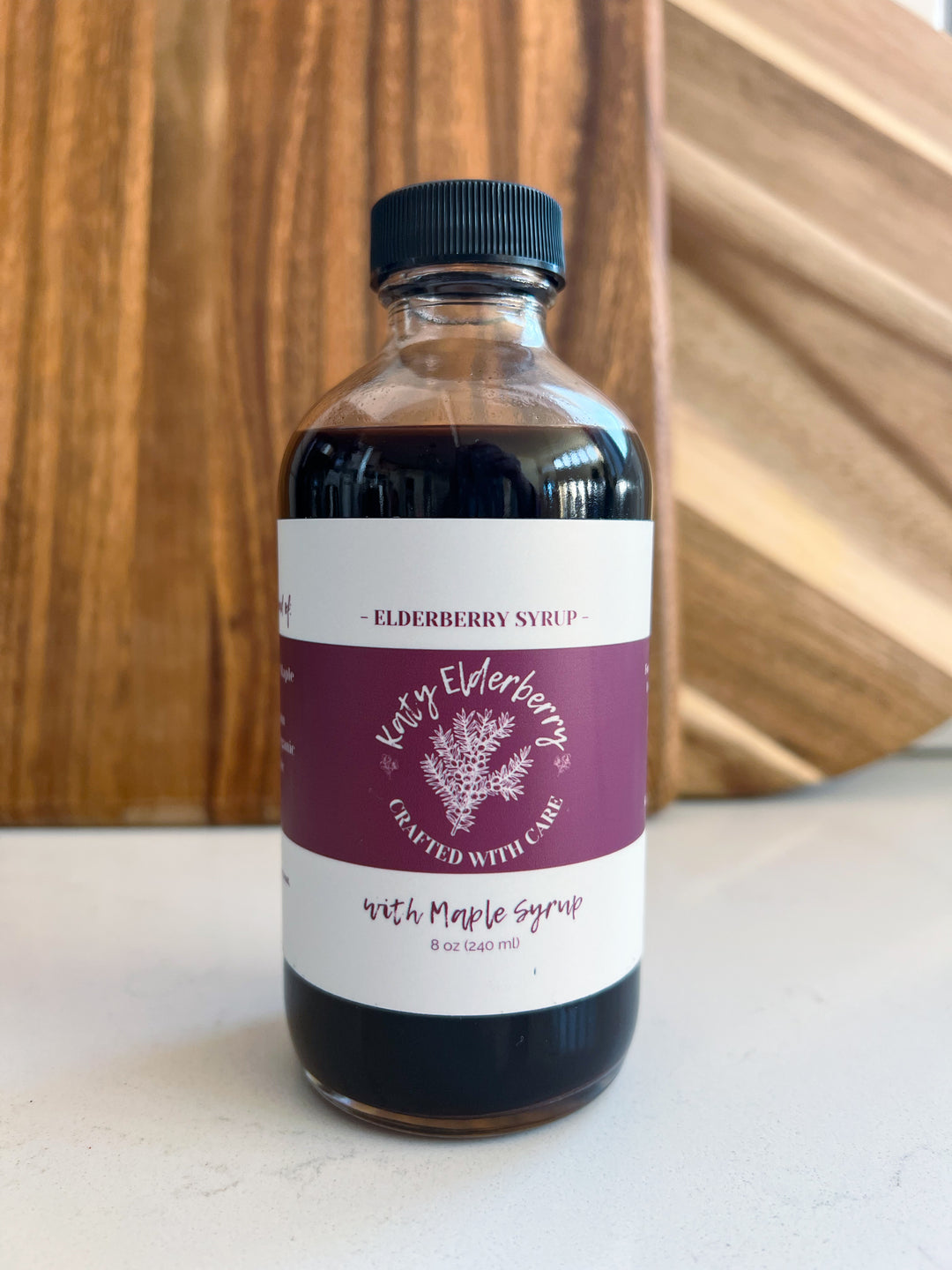 8 oz bottle of Katy Elderberry organic elderberry syrup with maple, a small-batch immune support supplement.