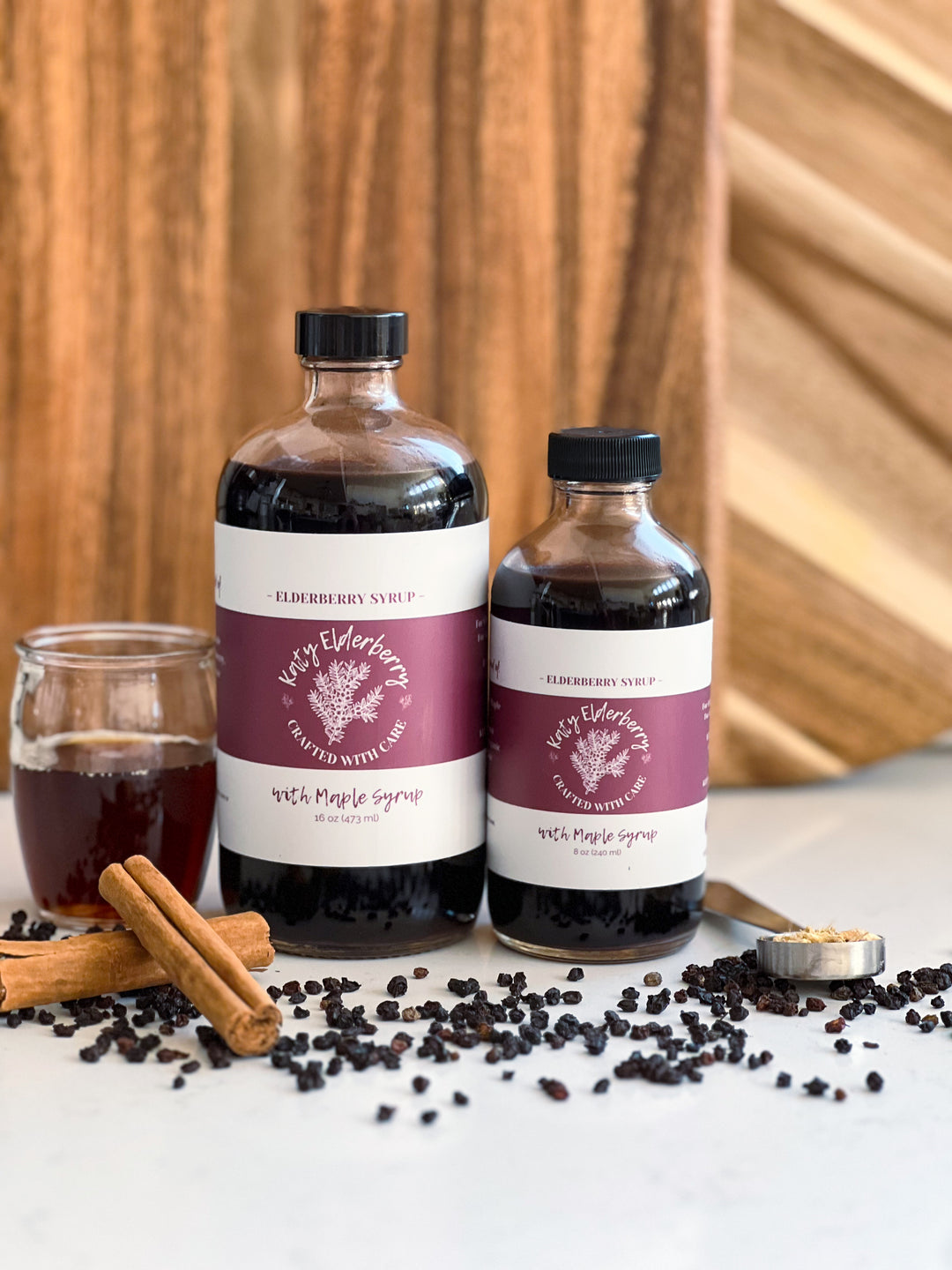 16 oz bottle of Katy Elderberry organic elderberry syrup with maple, a small-batch immune support supplement."